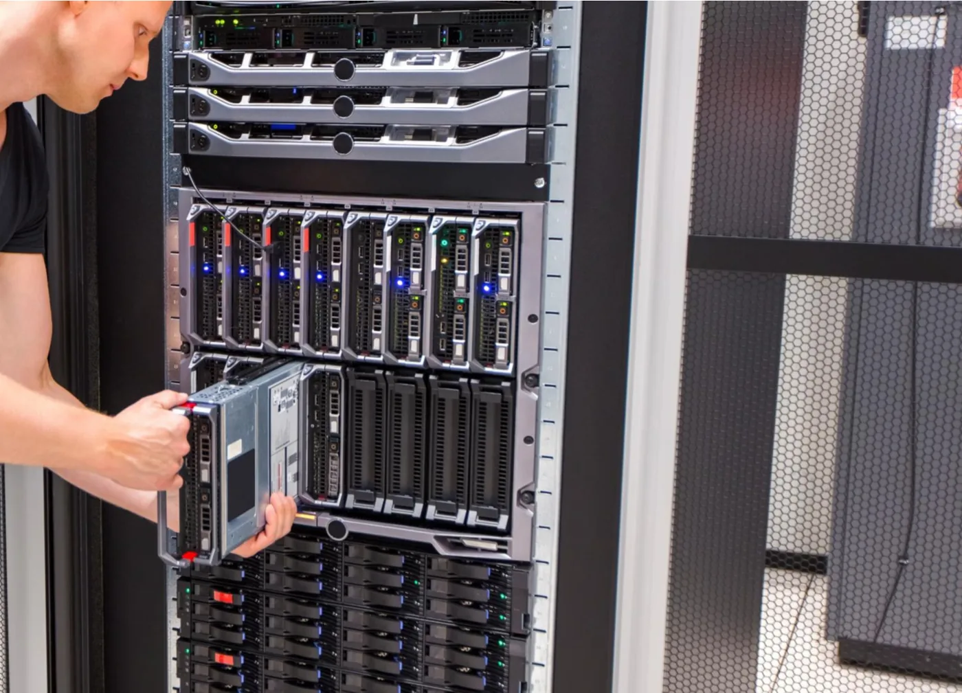 Engineer working on servers in a data centre rack